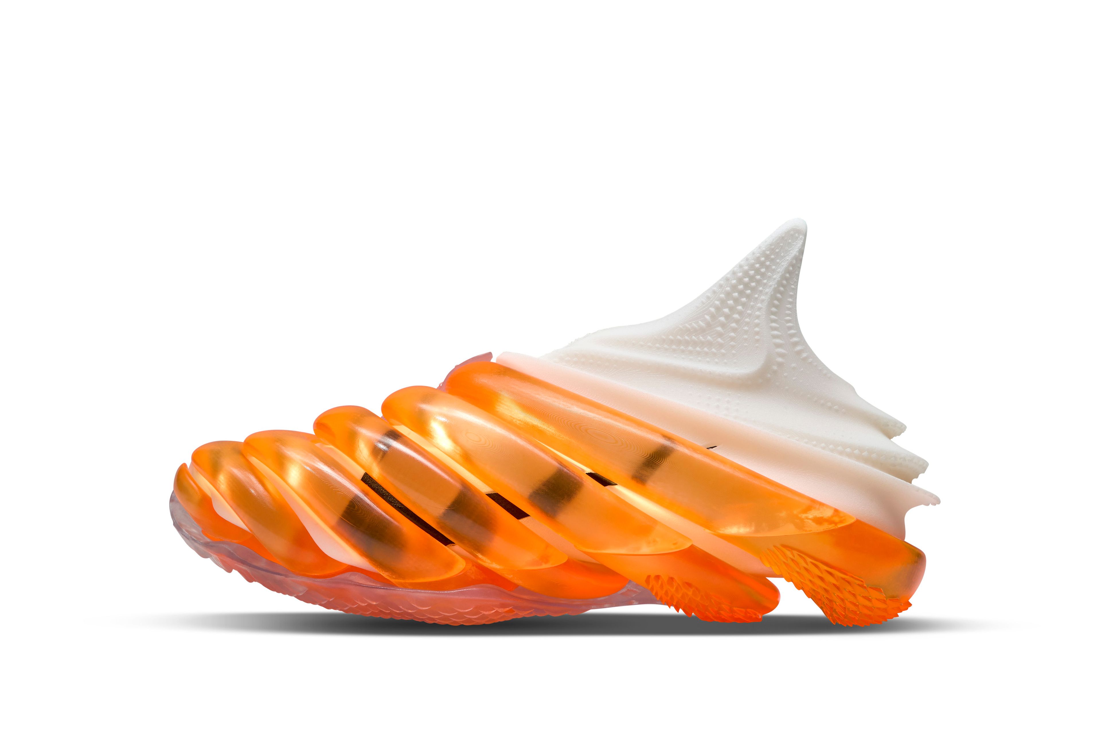 White experimental tennis shoe wrapped in translucent orange coils with a raised pointed collar